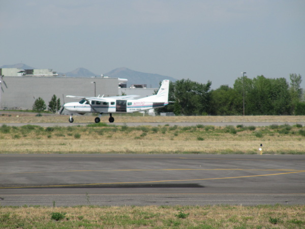 Jake's skydiving plane takes off.